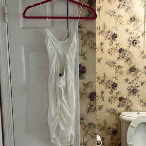 White body con dress with a criss cross back